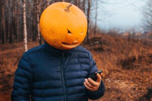 Person with a pumpkin head symbolizing spooky or misleading marketing metrics that look good but lack real value.