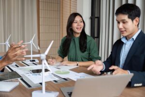 A speaker presenting to an audience in an auditorium, symbolizing global communication and the power of clear messaging in the cleantech industry.