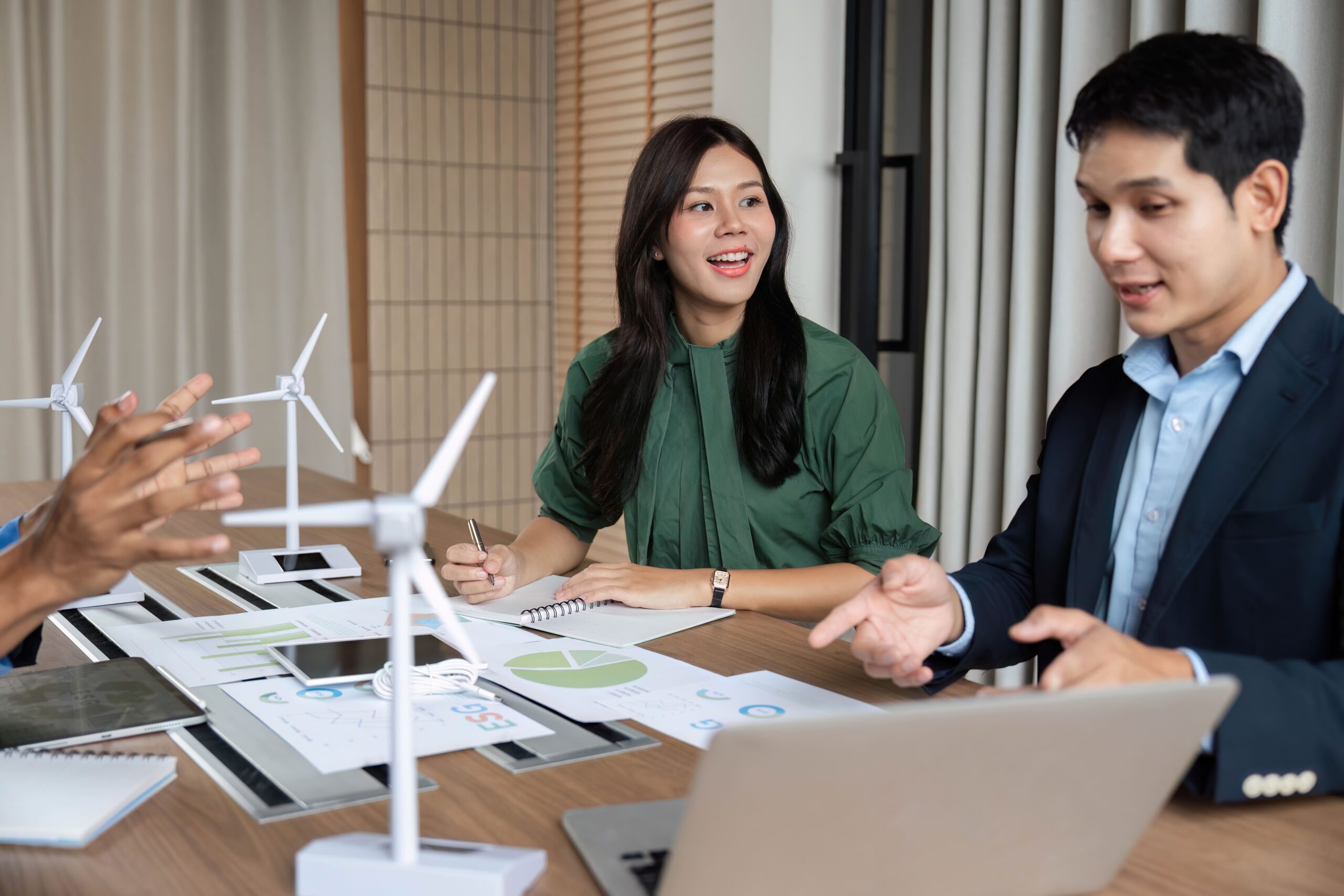 A speaker presenting to an audience in an auditorium, symbolizing global communication and the power of clear messaging in the cleantech industry.