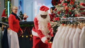 Christmas retail display with Santa figures and festive decorations inside a store, illustrating how brands use consistent seasonal signals to build recognition and trust.