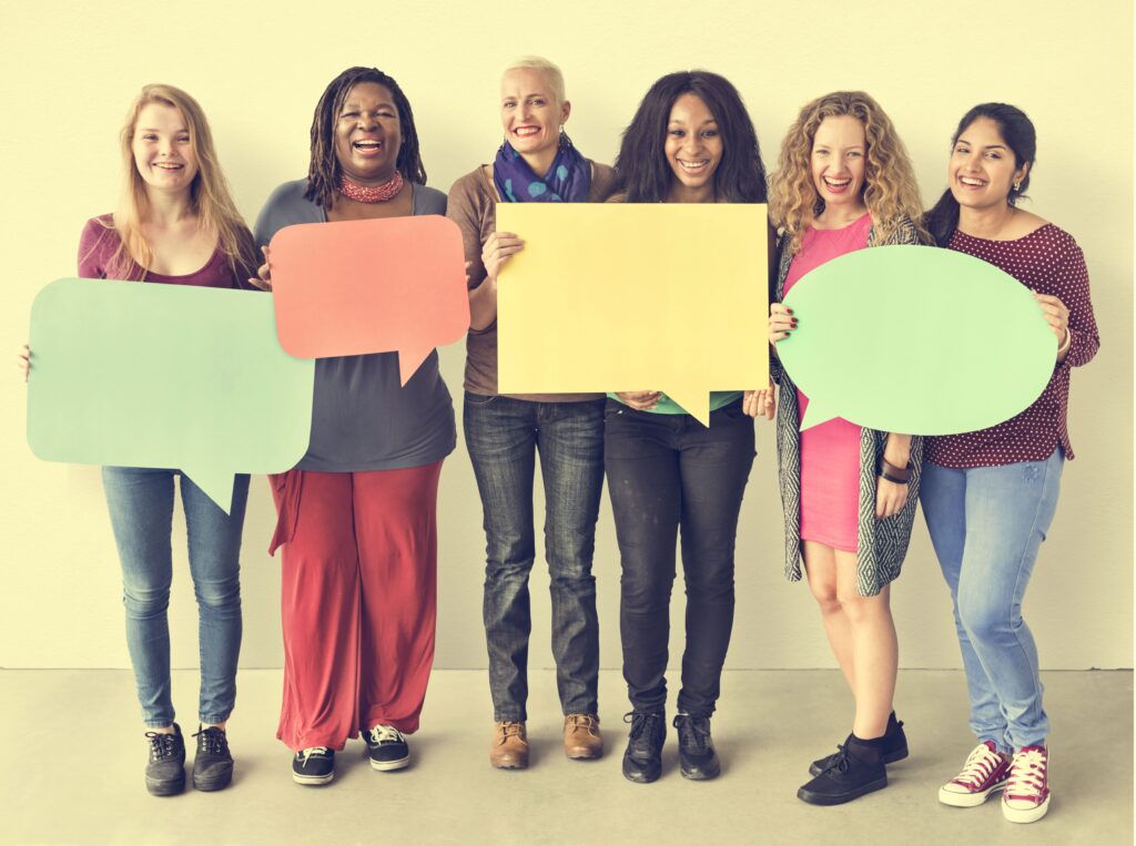 Group of people holding blank signs, symbolizing inconsistent or unclear messages within organizations.