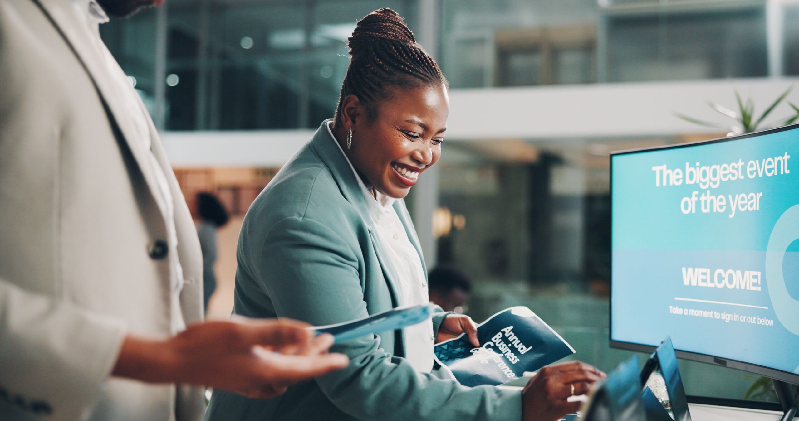 Professional woman reviewing information on a tablet, symbolizing visibility and communication challenges in the fintech sector.