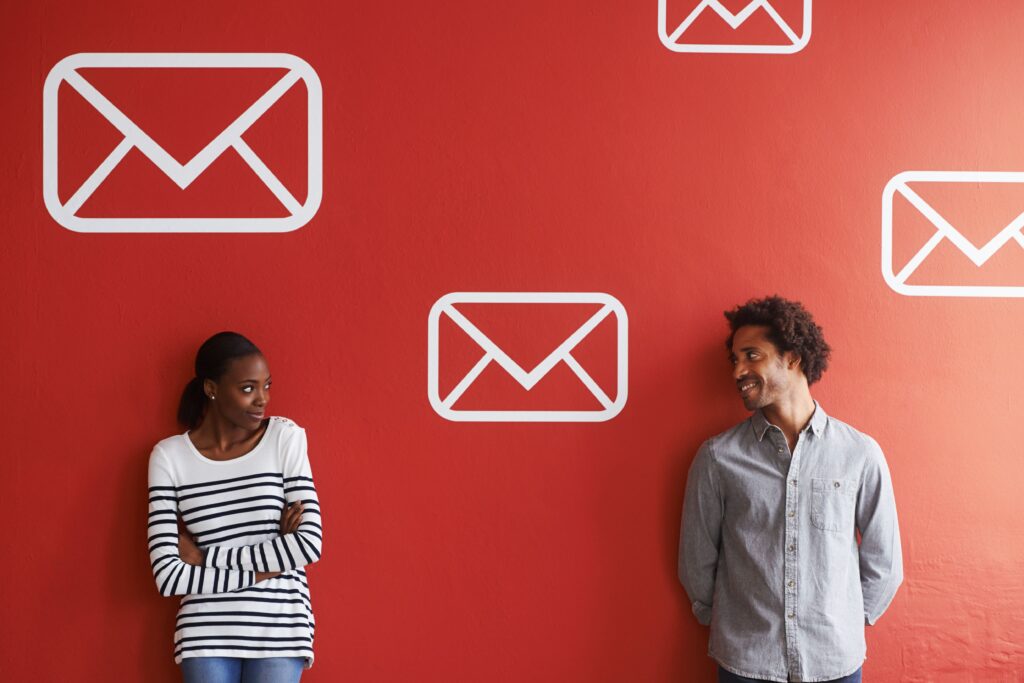 People in conversation in front of communication icons, representing the need to earn attention and trust before driving customer growth.