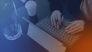 Professional using a laptop navigating a complex B2B website that lacks clear messaging and affects conversion